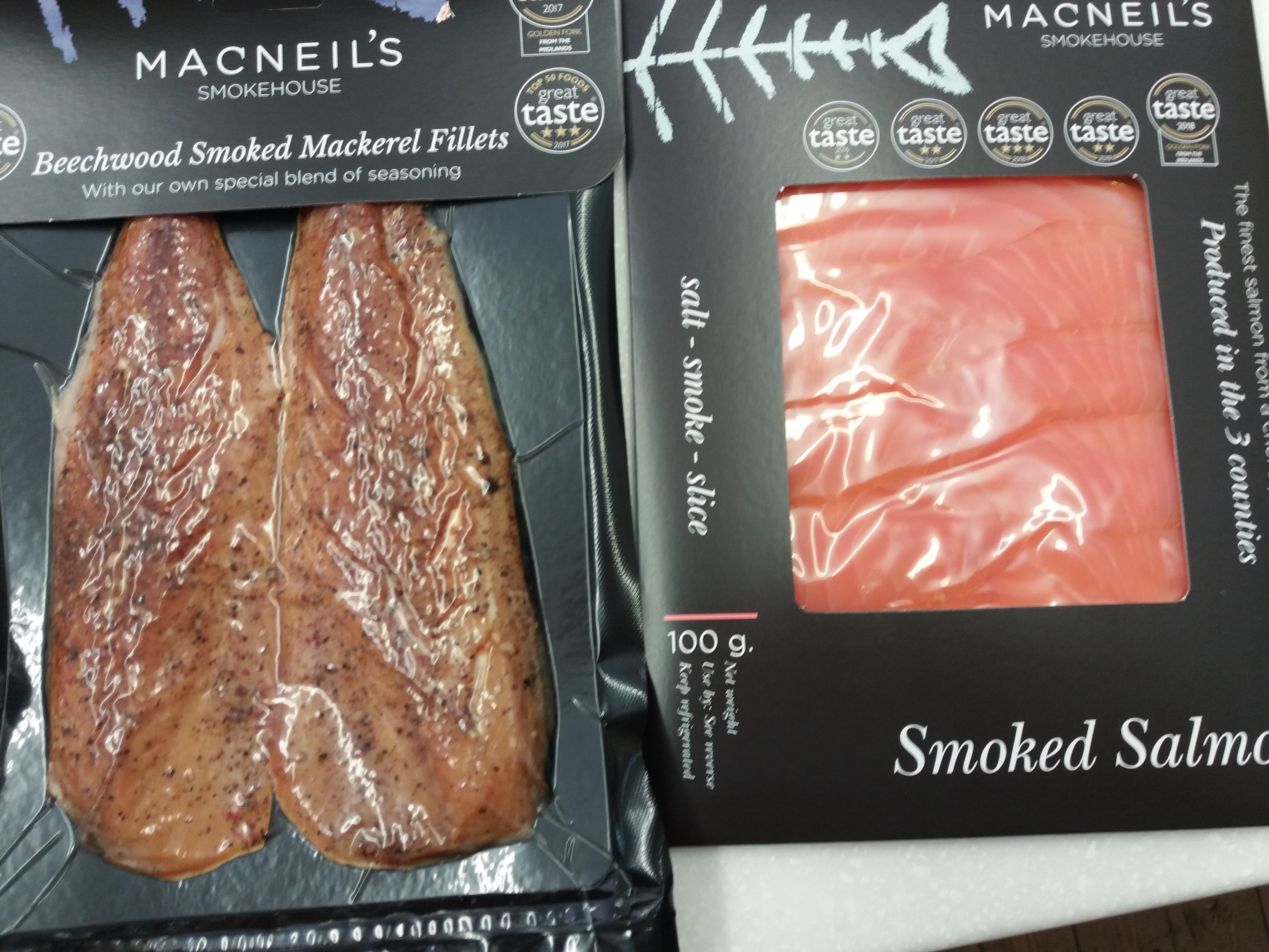 A photo shpwing packets of Macneil's smoked salmon and smoked mackerel