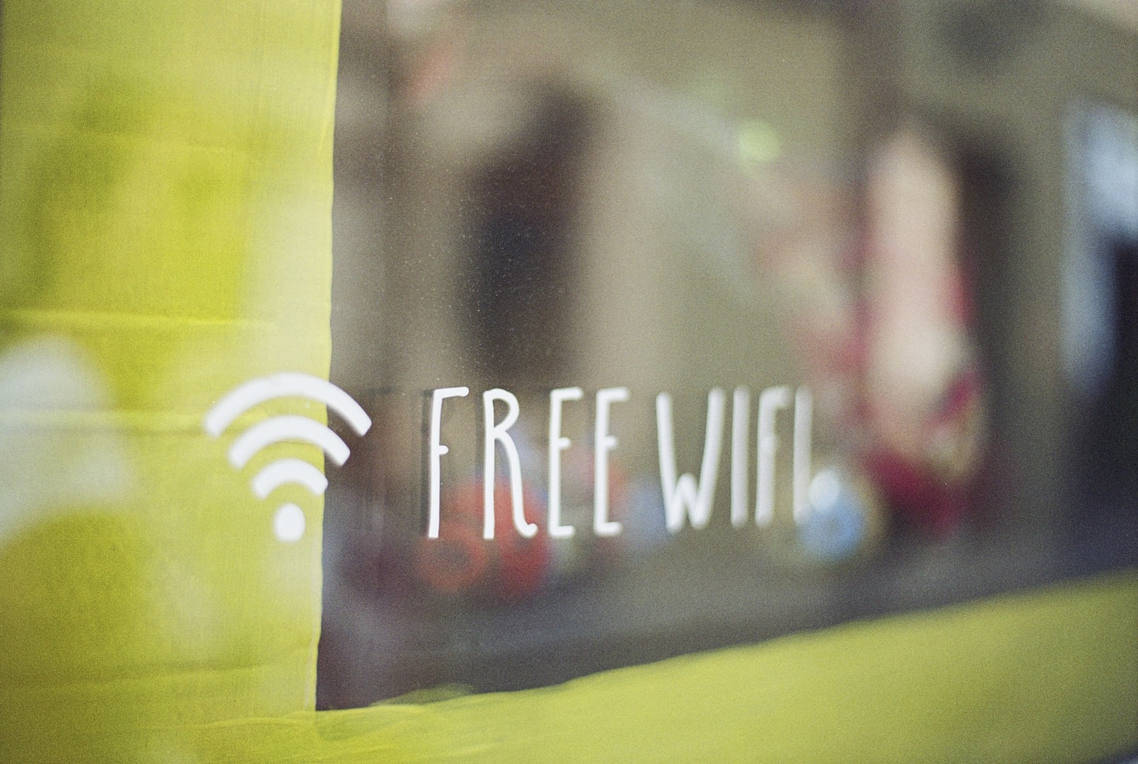 Photo of a window with signage saying free WiFi