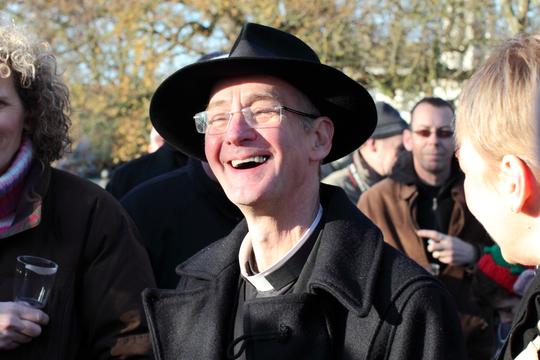 A photo of the Rev Richard Court smiling after blessing the Shop