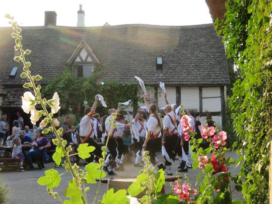 A photo of Morris Men dancing outside The Fleece Inn Bretforton