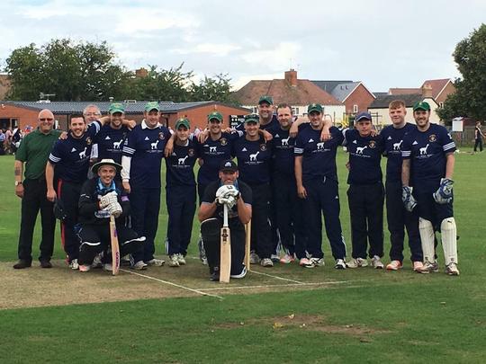 Bretforton Cricket team pose for a photo on the pitch