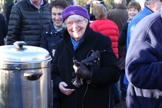 A photo of a smiling village resident at the grand opening of Bretforton Community Shop