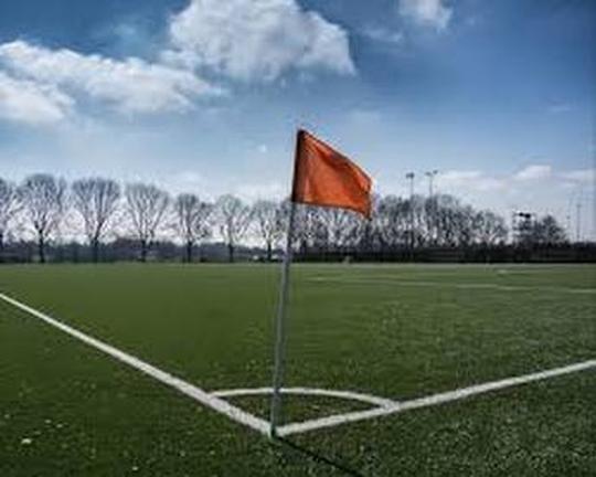 A photo of the football pitch at Bretforton Sports Club with the corner and corner flag in the foreground
