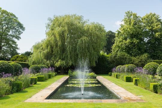Photo of a large pond & fountain in the gardens of holiday accommodation in Bretforton